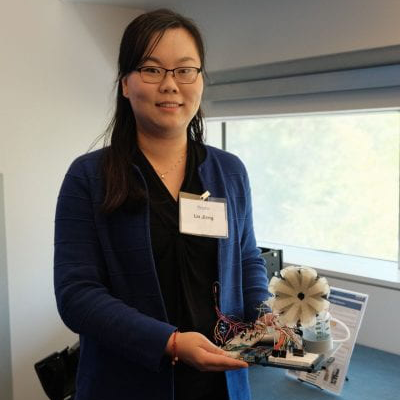 Lin Jiang poses with her smart breast pump prototype.