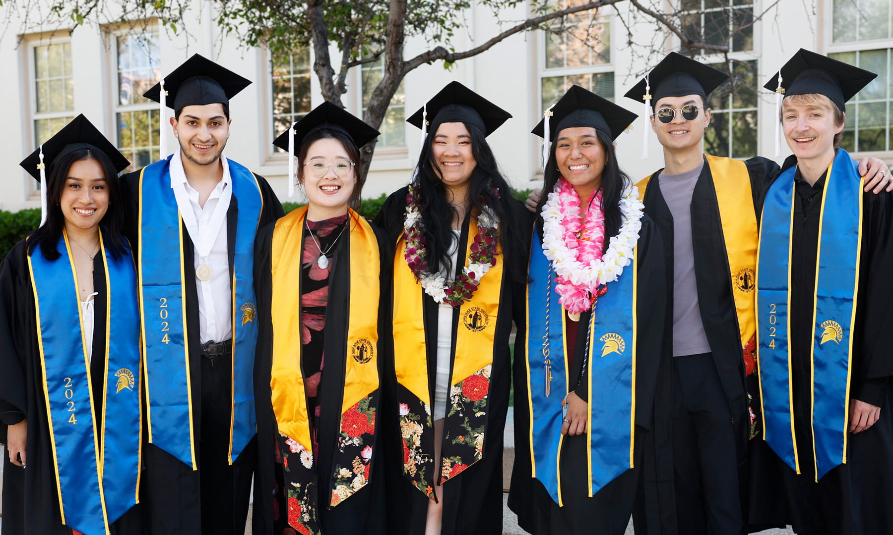 A diverse group of 7 SJSU Graduates