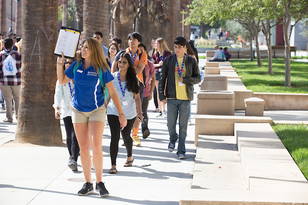 Tour guide leading students on a tour of campus.