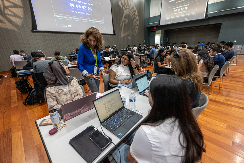 Students with President Teniente-Matson at the NVIDIA Hackathon