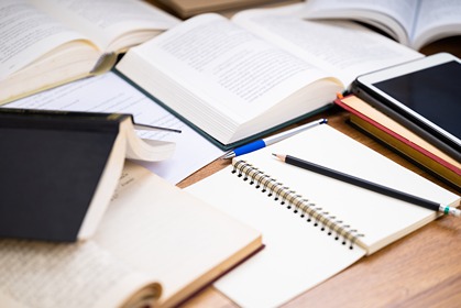 books and writing journal refer to reasearch, scholarship and creative academic activities.