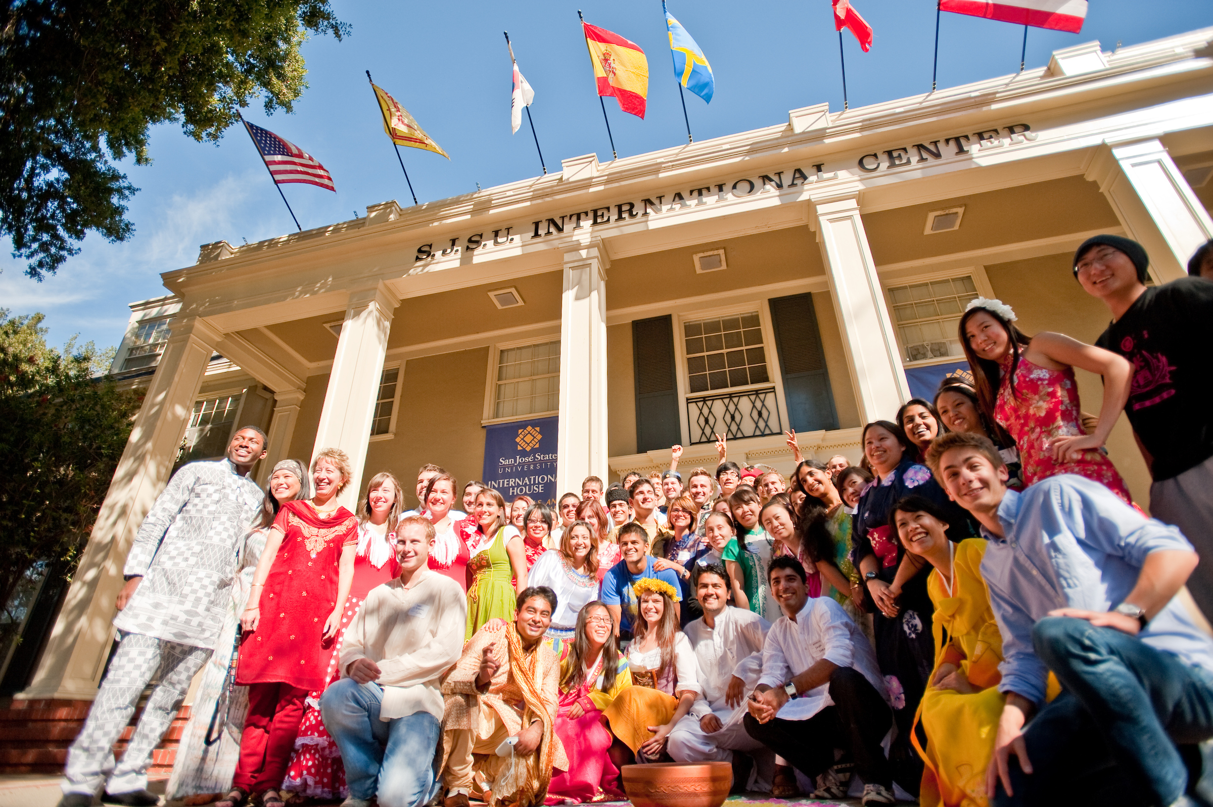 A group of international students pose outside the SJSU International Center.