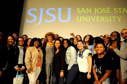 Angela Davis stands with a group of students