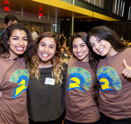 Smiling Latina/Chicana students at an SJSU event