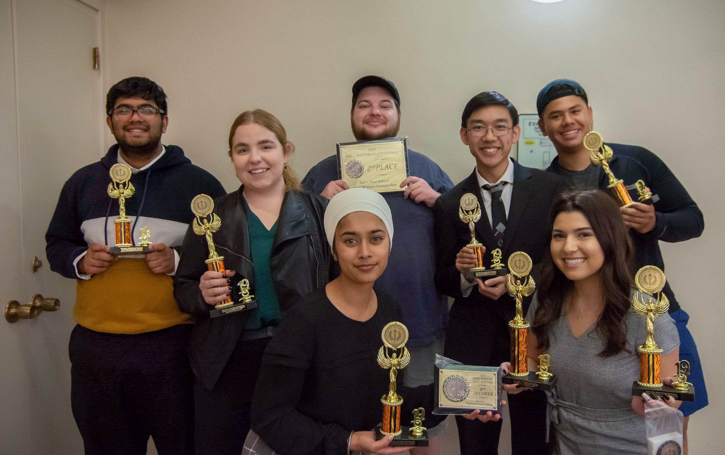 A group picture of Forensics Team members posing with their awards.