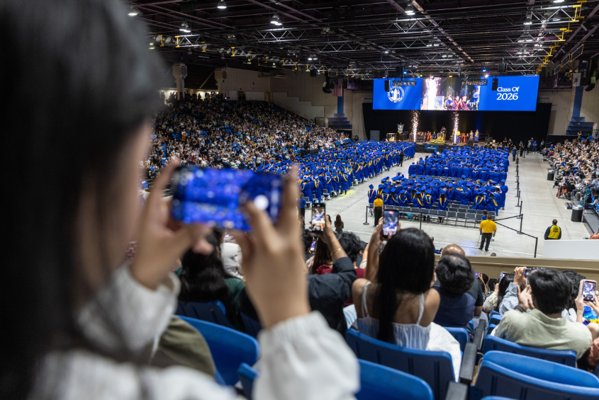 Student taking picture of the Commencement ceremony