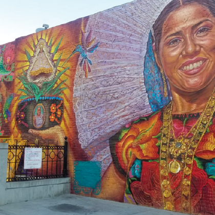 smiling woman on mural