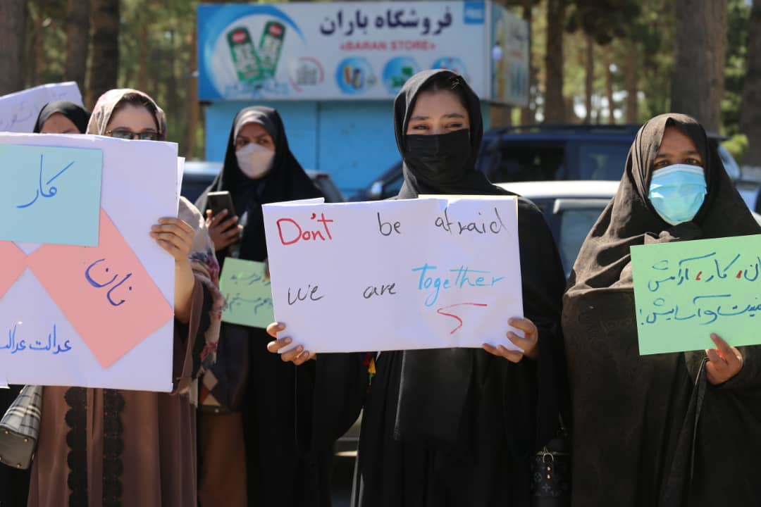 Afghan women with signs