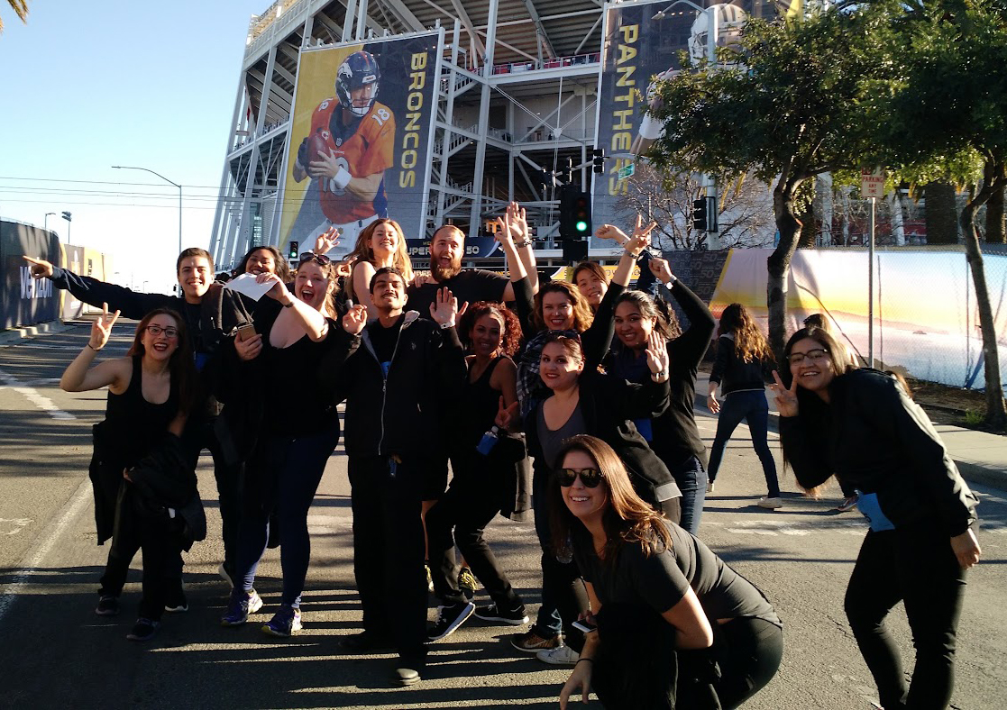 Hospitality students in front of stadium
