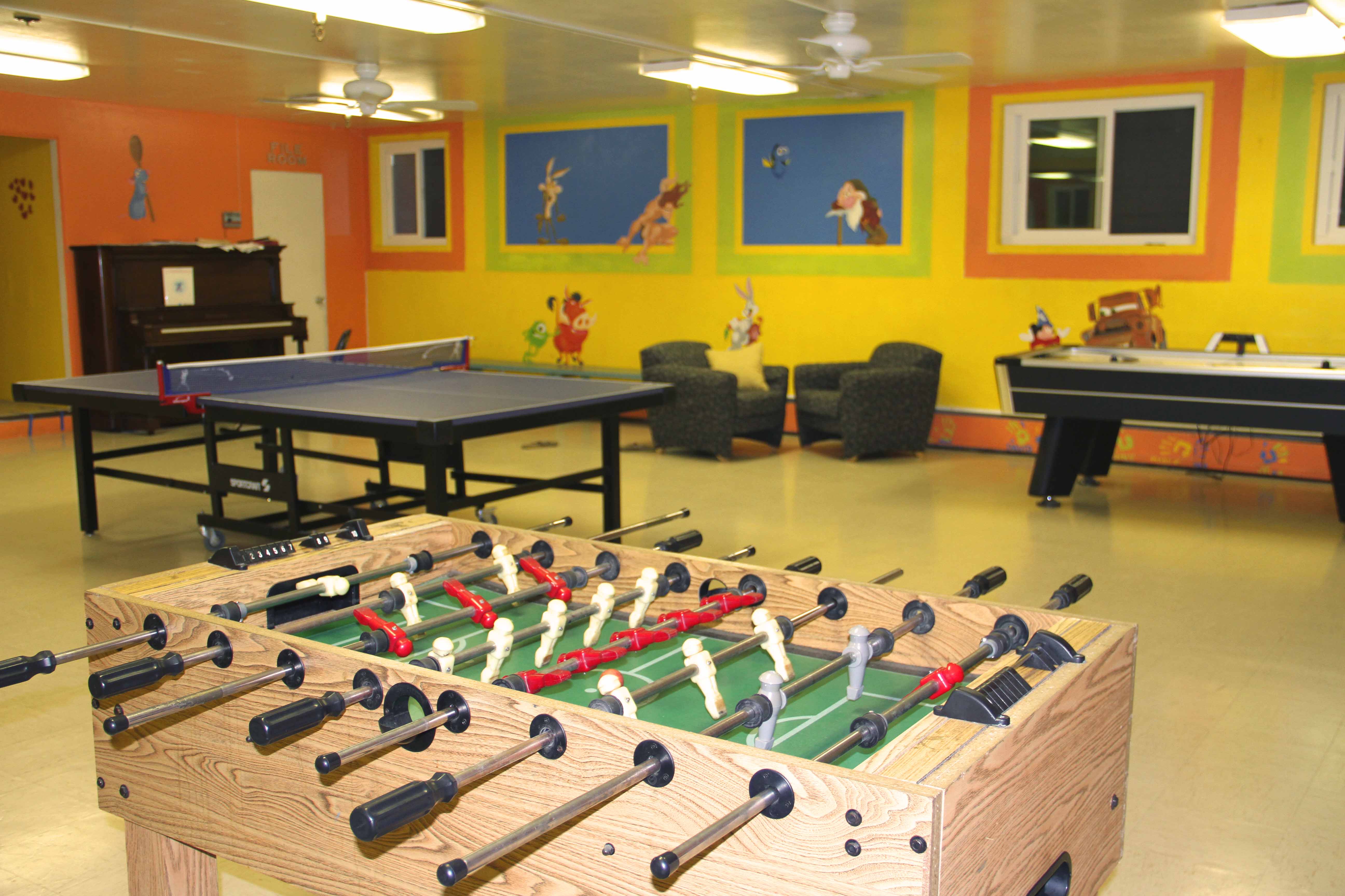 Residents Playing Fussball in Recreation Room