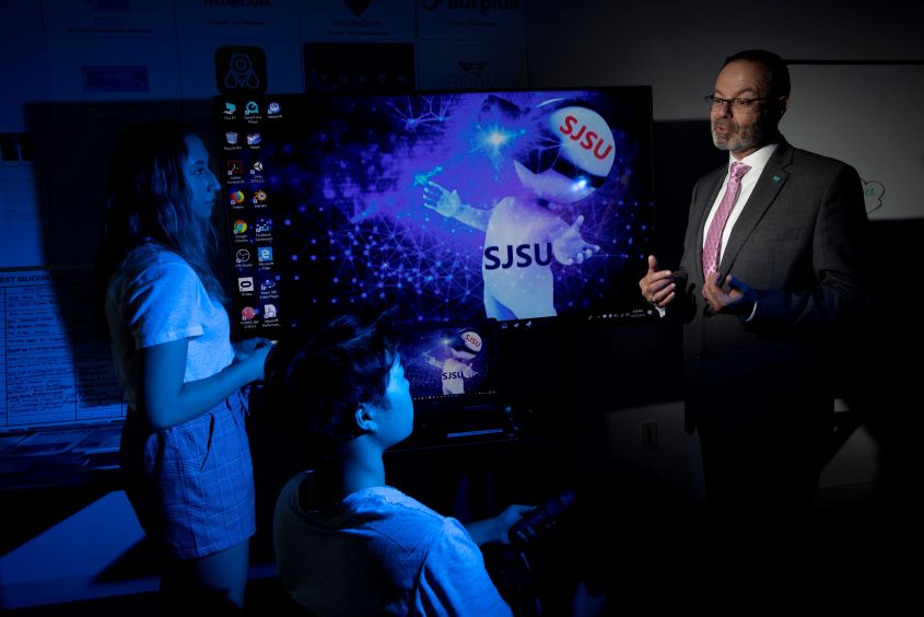 Students demonstrate the VR technology to the President for Research and Innovation at the IDEA lab at SJSU.