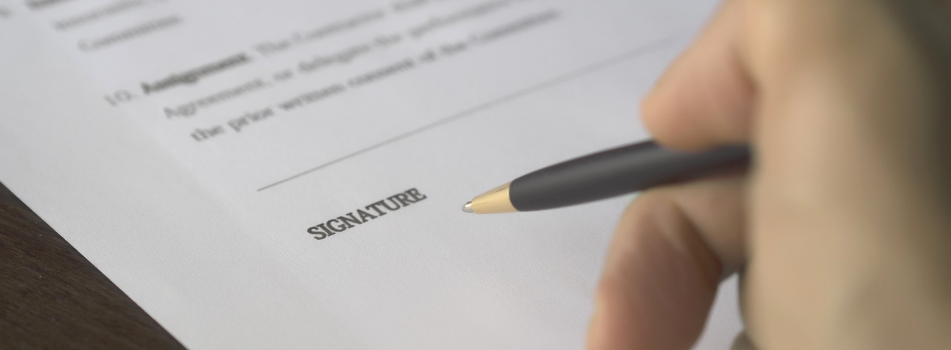 Person signing a form.