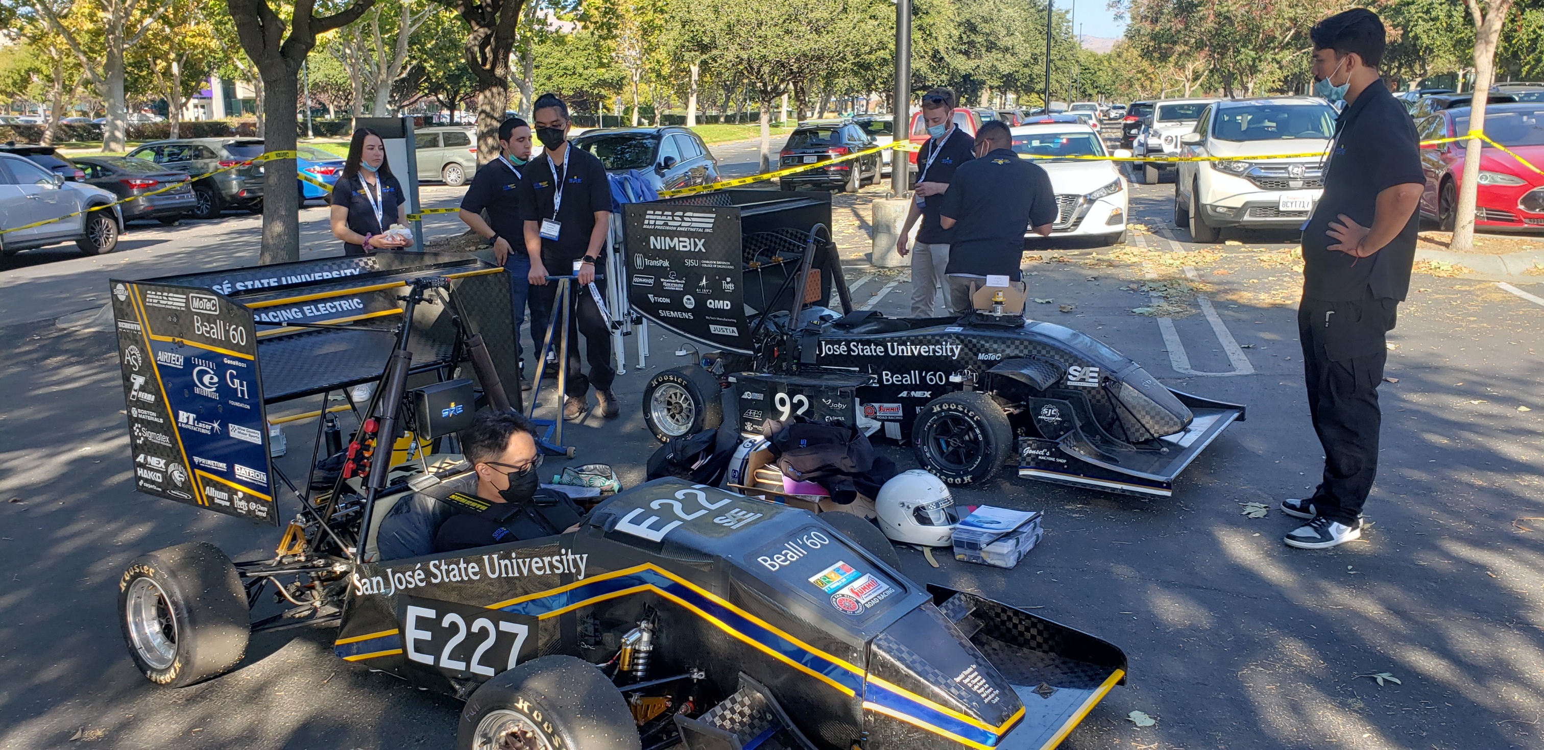 image of SJSU students in and around SAE racing vehicles