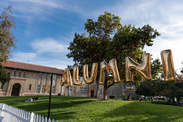 color image of gold balloons spelling alumni