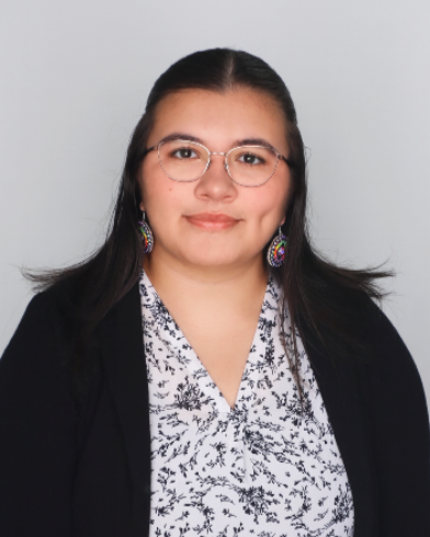 NAISSC Program Coordinator, headshot of Kateri Azure smiling at camera.