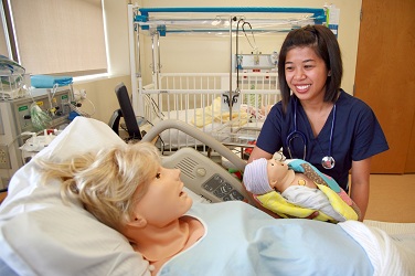 Nurses in the TVFSON Simulation Lab using baby-simulating tech to learn and teach.