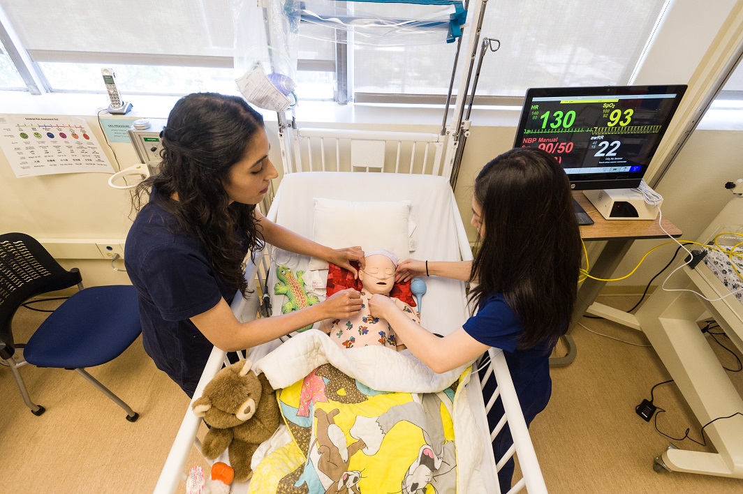 Nurses in the TVFSON Simulation Lab using baby-simulating tech to learn and teach.