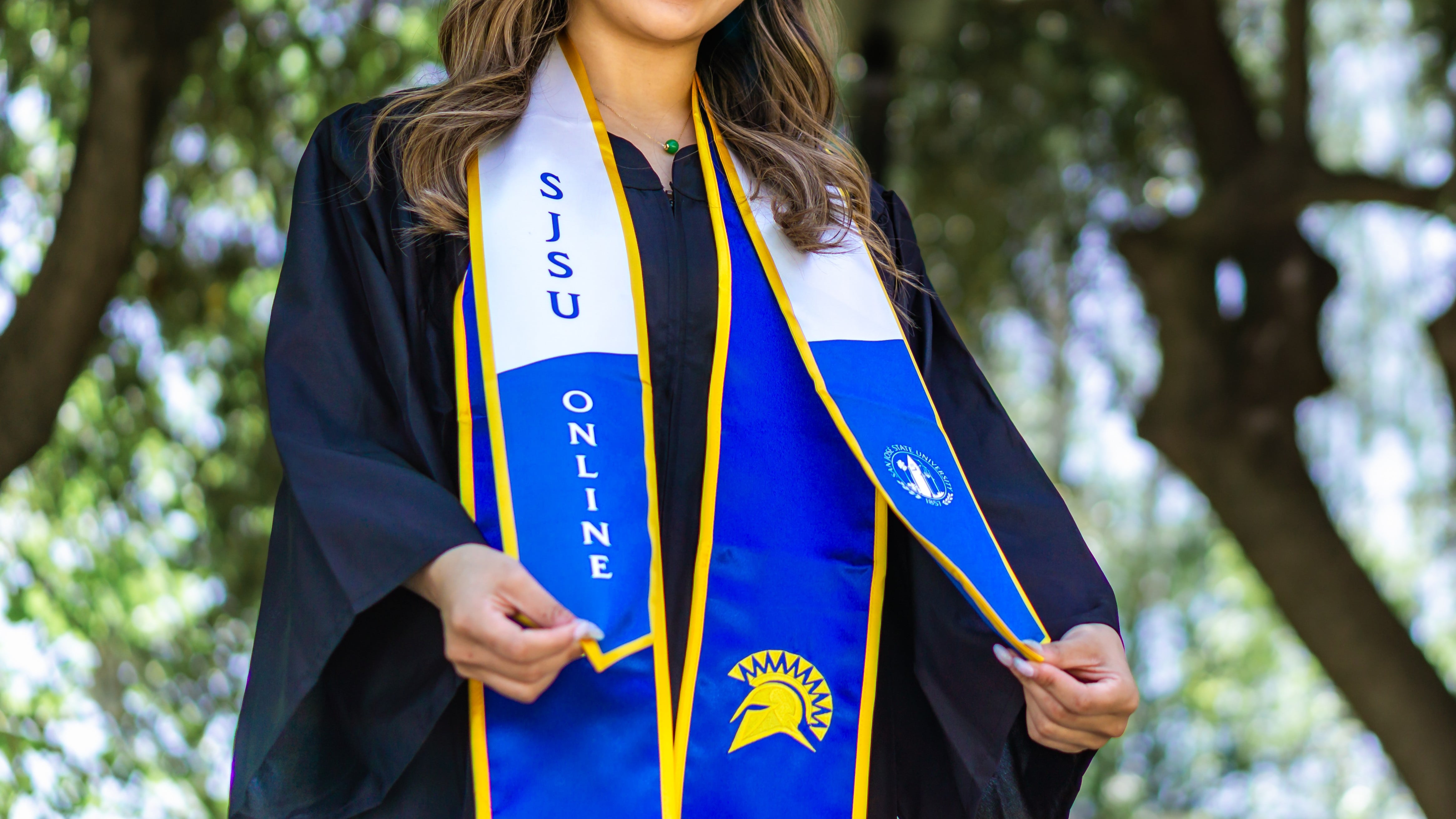 SJSU Online student graduating on campus