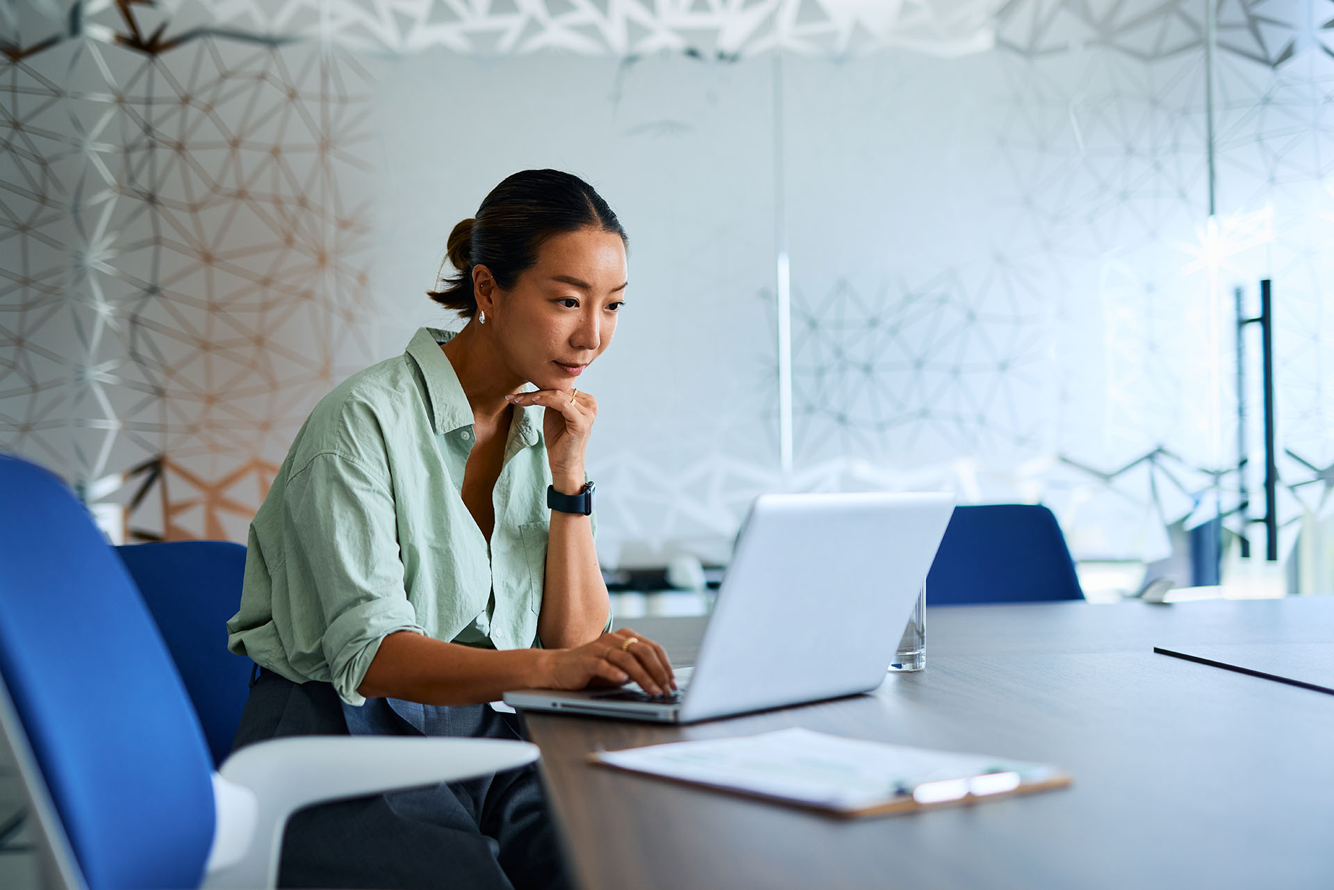 Female digital assets professional in an office