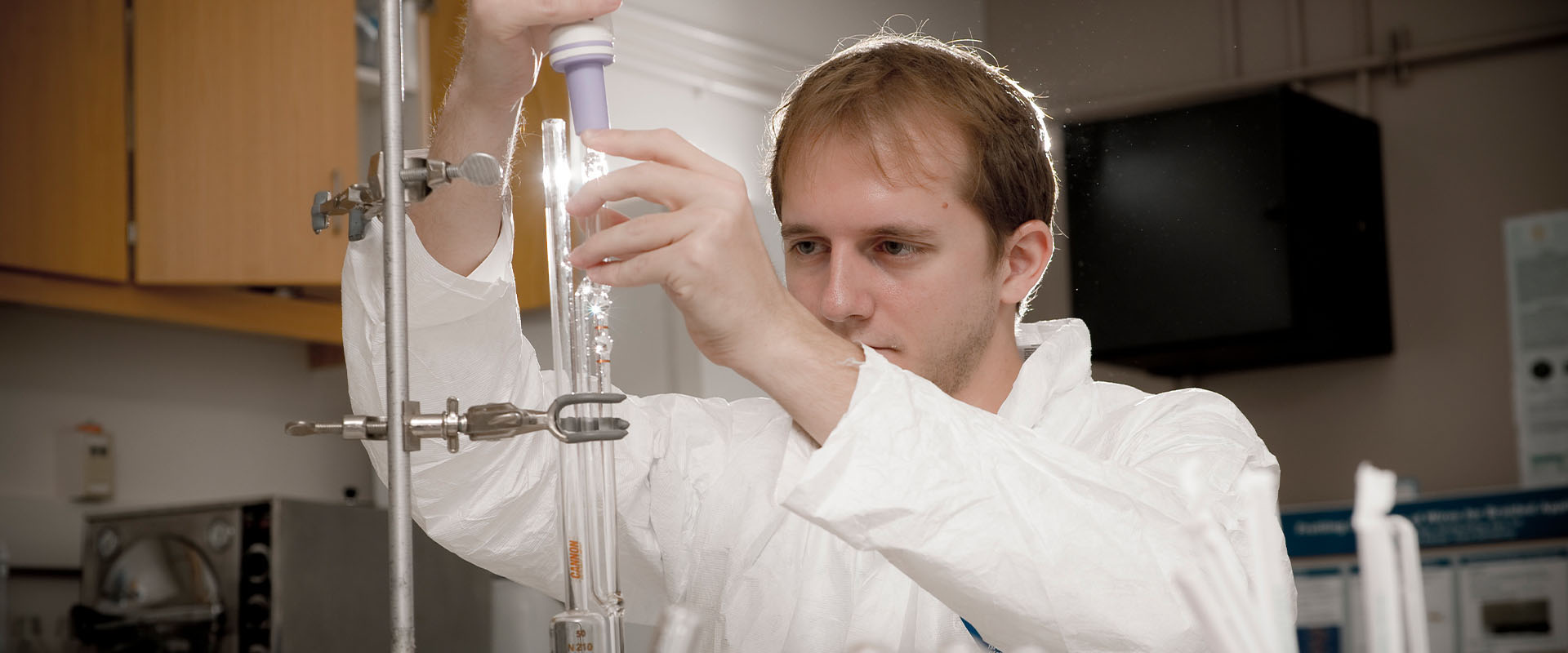 Male science student in lab gear