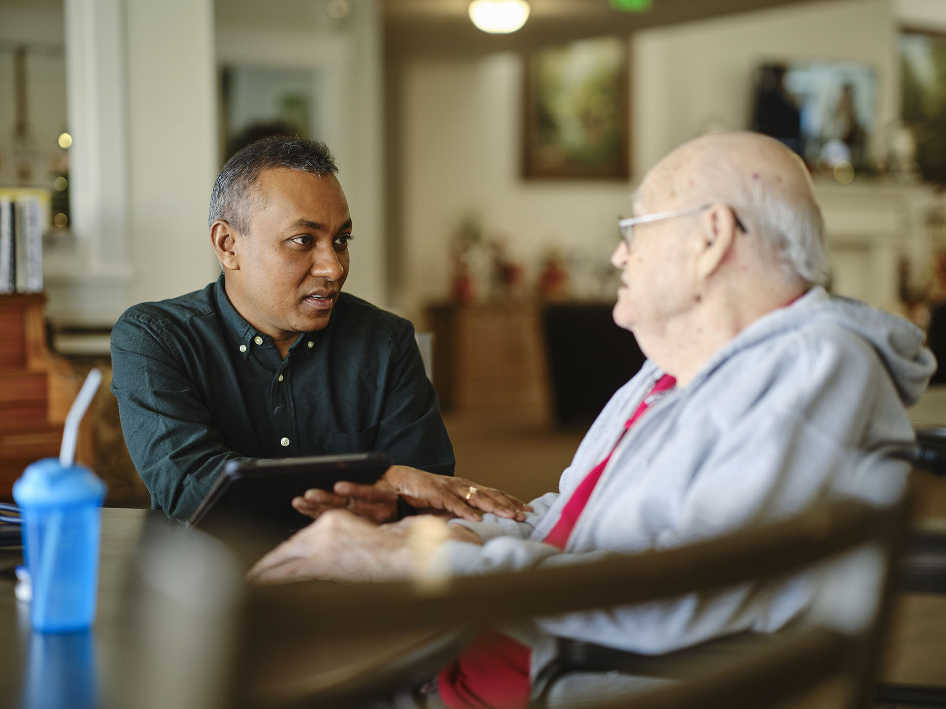 Male social worker with elderly man