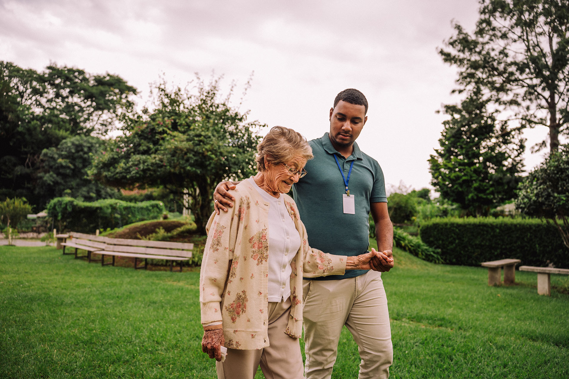 Male social worker with elderly woman