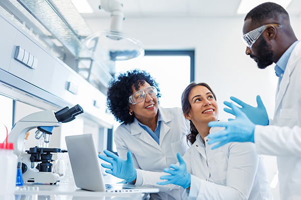 Scientists discussing in lab