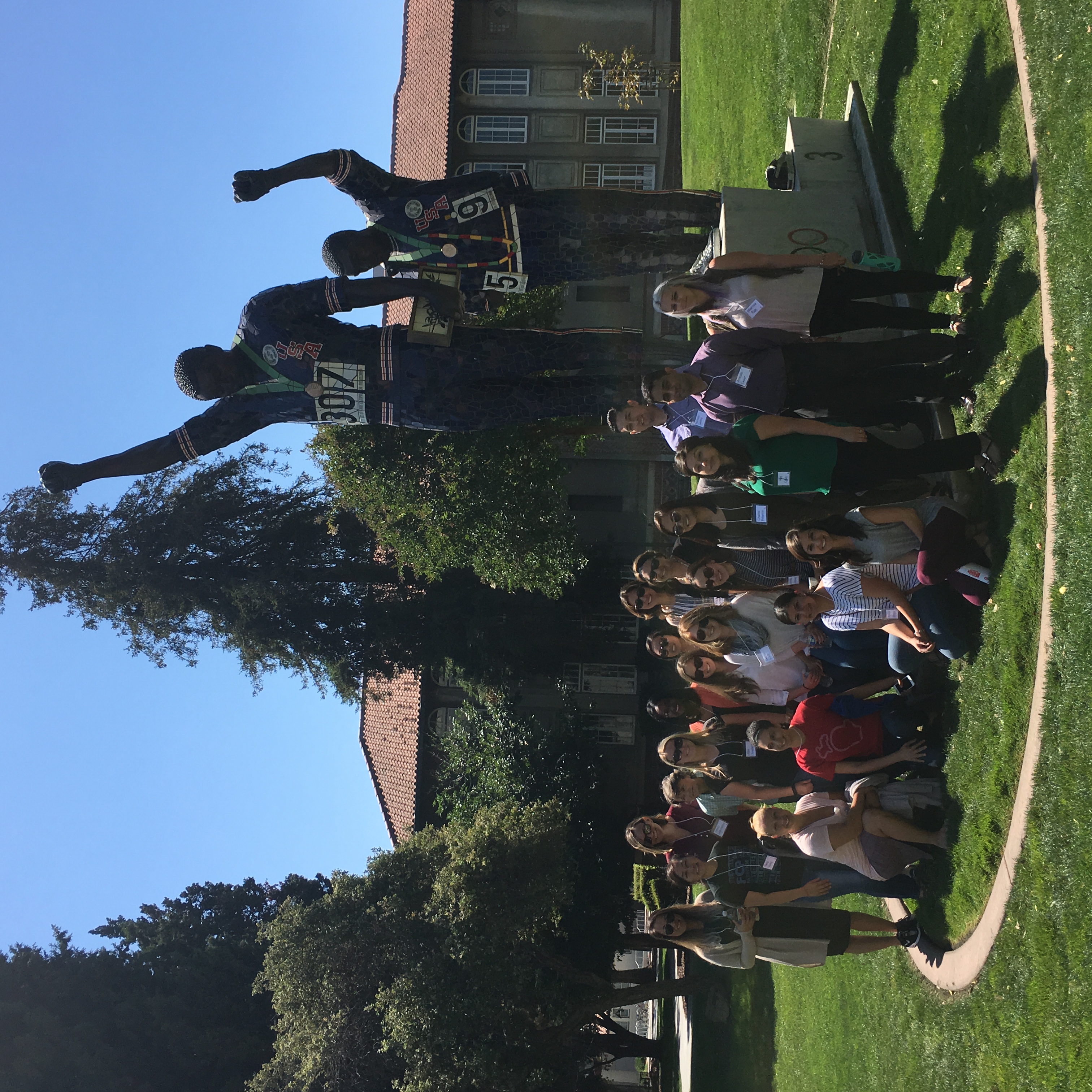 Public health students in front of SJSU Tommy's statue