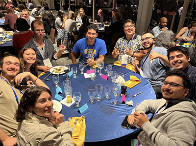 Photograph of CalBridge scholars and mentors around a table.