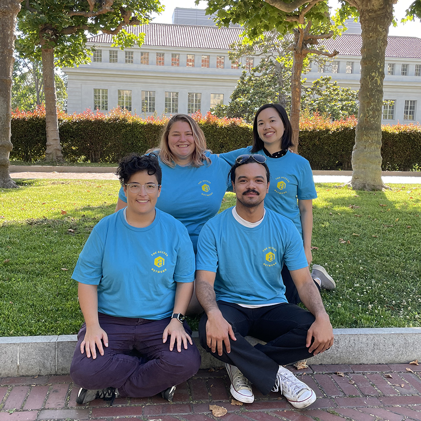 Brianne Guttmann, Gina Quan, Annie Chase, and Gabriel Gaeta pose in front of a UC Berkeley campus building.