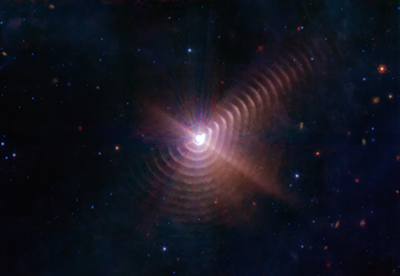 Telescope image of dust rings around the Wolf-Rayet binary star.