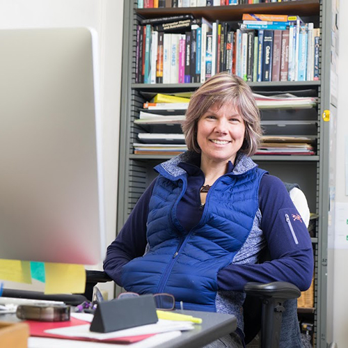 Photograph of Prof. Monika Kress in an office.