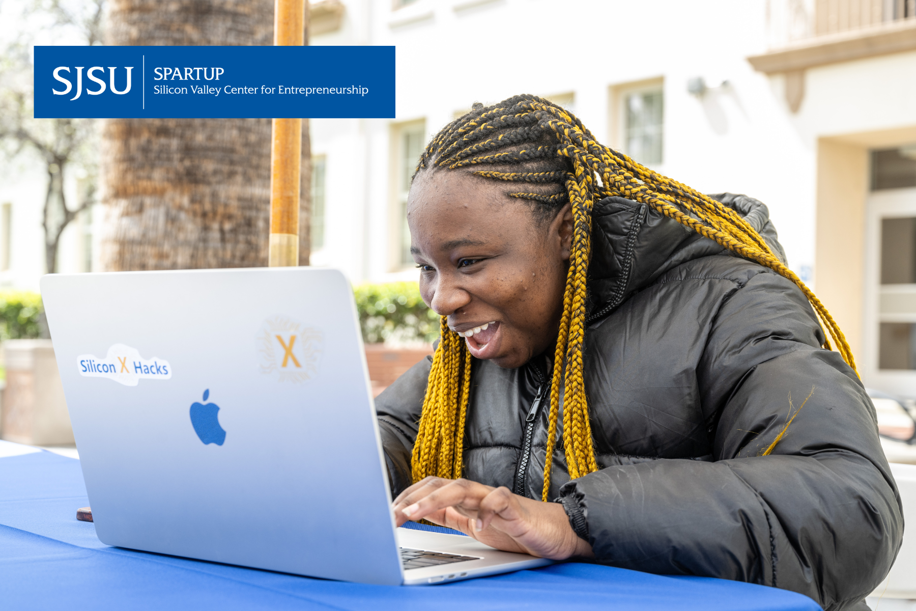 Student on computer at SpartUp Innovation Showcase 