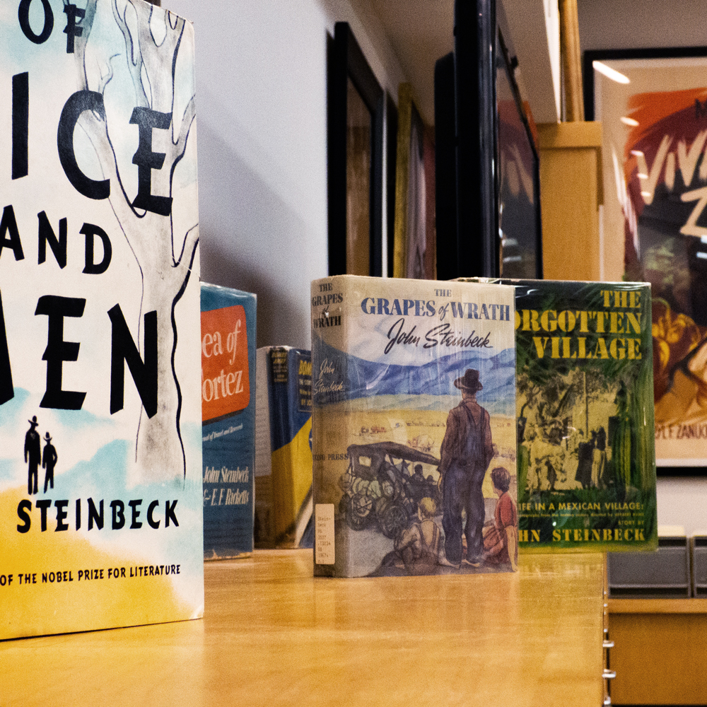 Steinbeck novels on a cabinet in the Steinbeck Center.