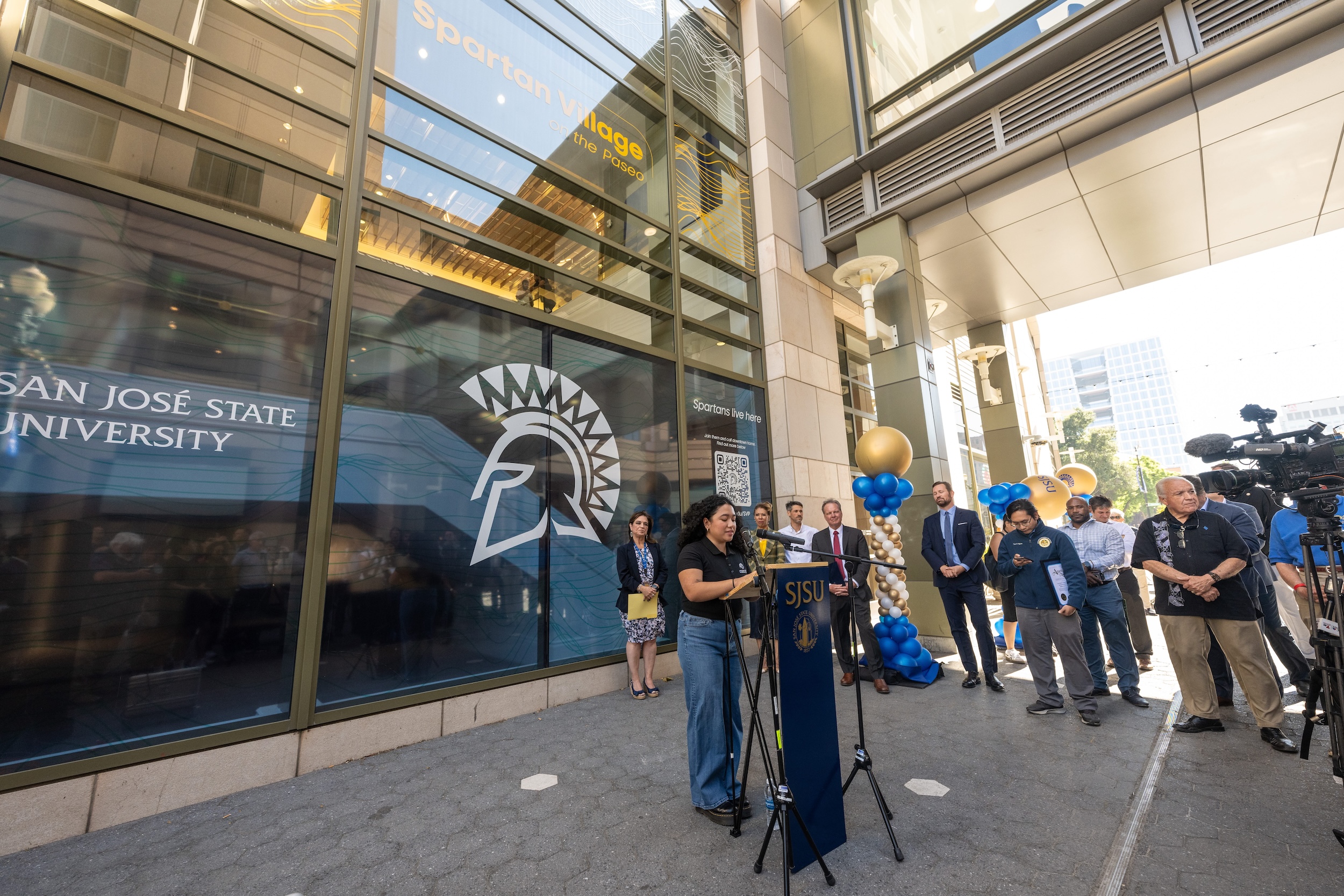 San José State A.S. Student Body President Ariana Lacson speaks at the ribbon cutting for the Spartan Village on the Paseo on August 15. Photo by Robert C. Bain.