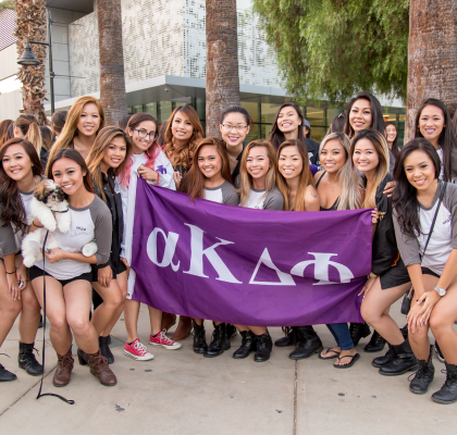 Sorority students with banner